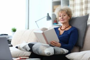 Elderly Woman Reading to keep brain active and healthy